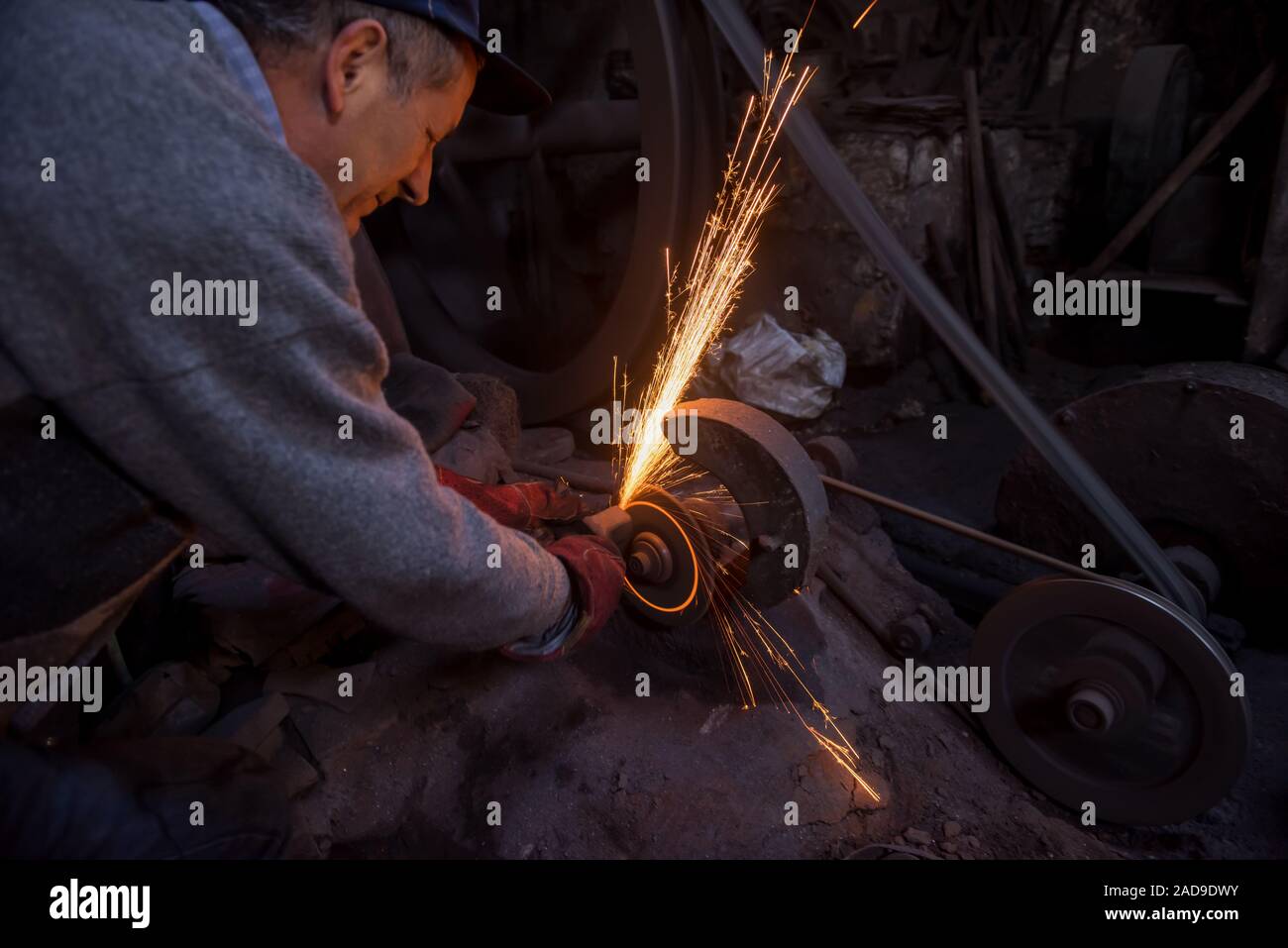the blacksmith polishing metal products Stock Photo Alamy