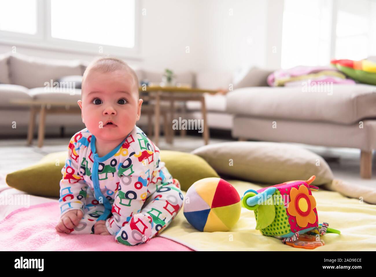 Baby sitting on blankets hi-res stock photography and images - Alamy