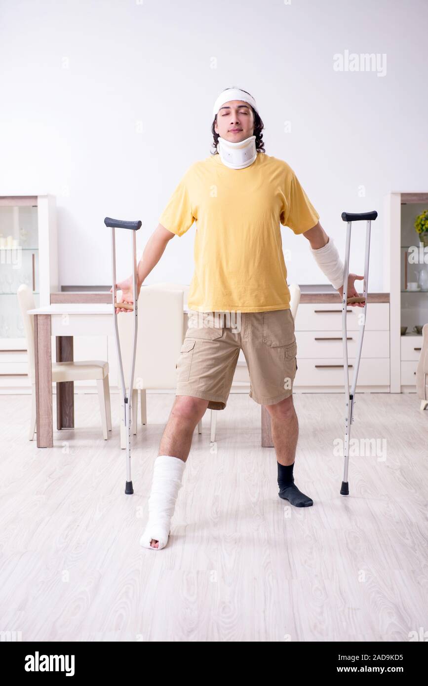 Young man after accident recovering at home Stock Photo