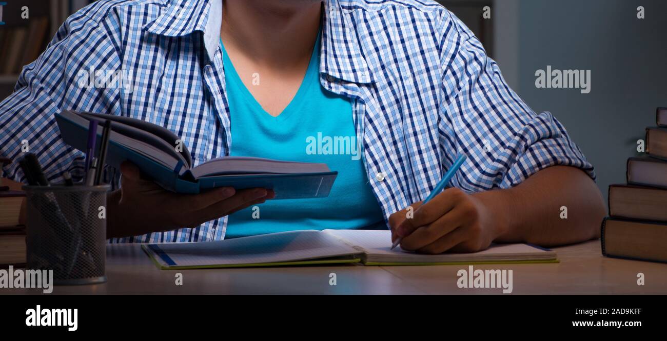 Student preparing for exams late night at home Stock Photo - Alamy