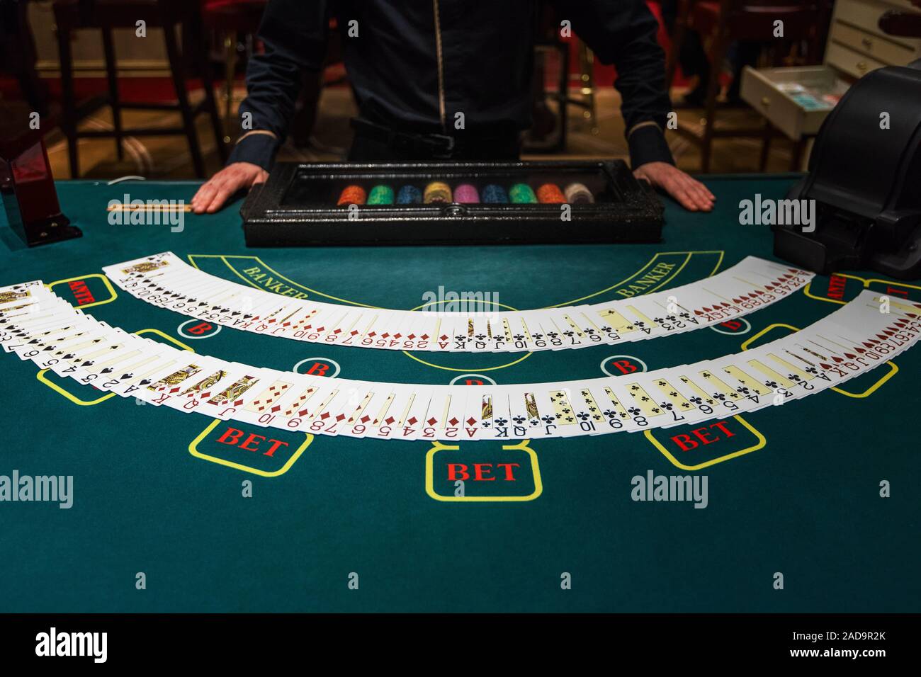 Professional croupier during cards Stock Photo - Alamy