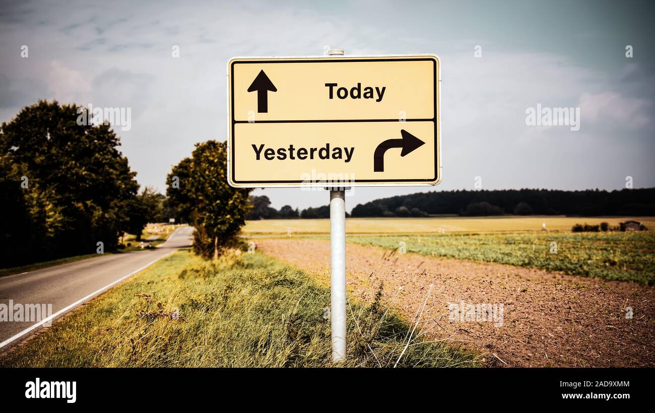 Wall Sign Today versus Yesterday Stock Photo - Alamy
