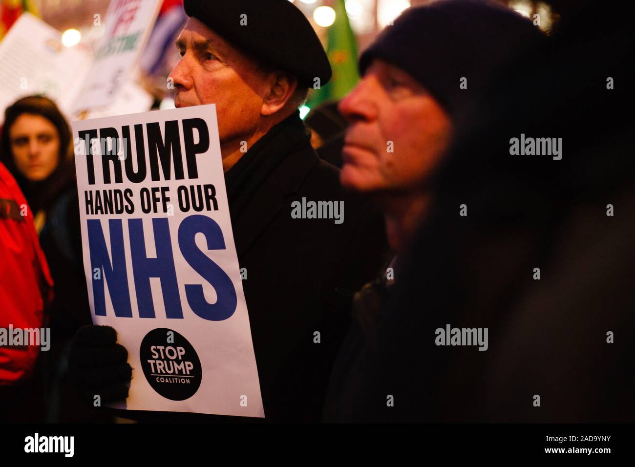 London, UK. 03rd Dec, 2019. An activist holds a placard opposing any post-Brexit US market access to Britain's National Health Service (NHS) during the demonstration.President Trump arrived in the UK on a three-day visit last night, chiefly to attend the NATO summit in Watford. Activists protest against Trump's visit in Trafalgar Square. Credit: SOPA Images Limited/Alamy Live News Stock Photo