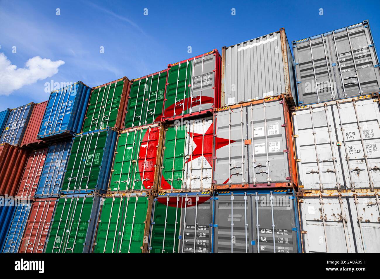 https://c8.alamy.com/comp/2ADA09H/the-national-flag-of-algeria-on-a-large-number-of-metal-containers-for-storing-goods-stacked-in-rows-on-top-of-each-other-conception-of-storage-of-go-2ADA09H.jpg