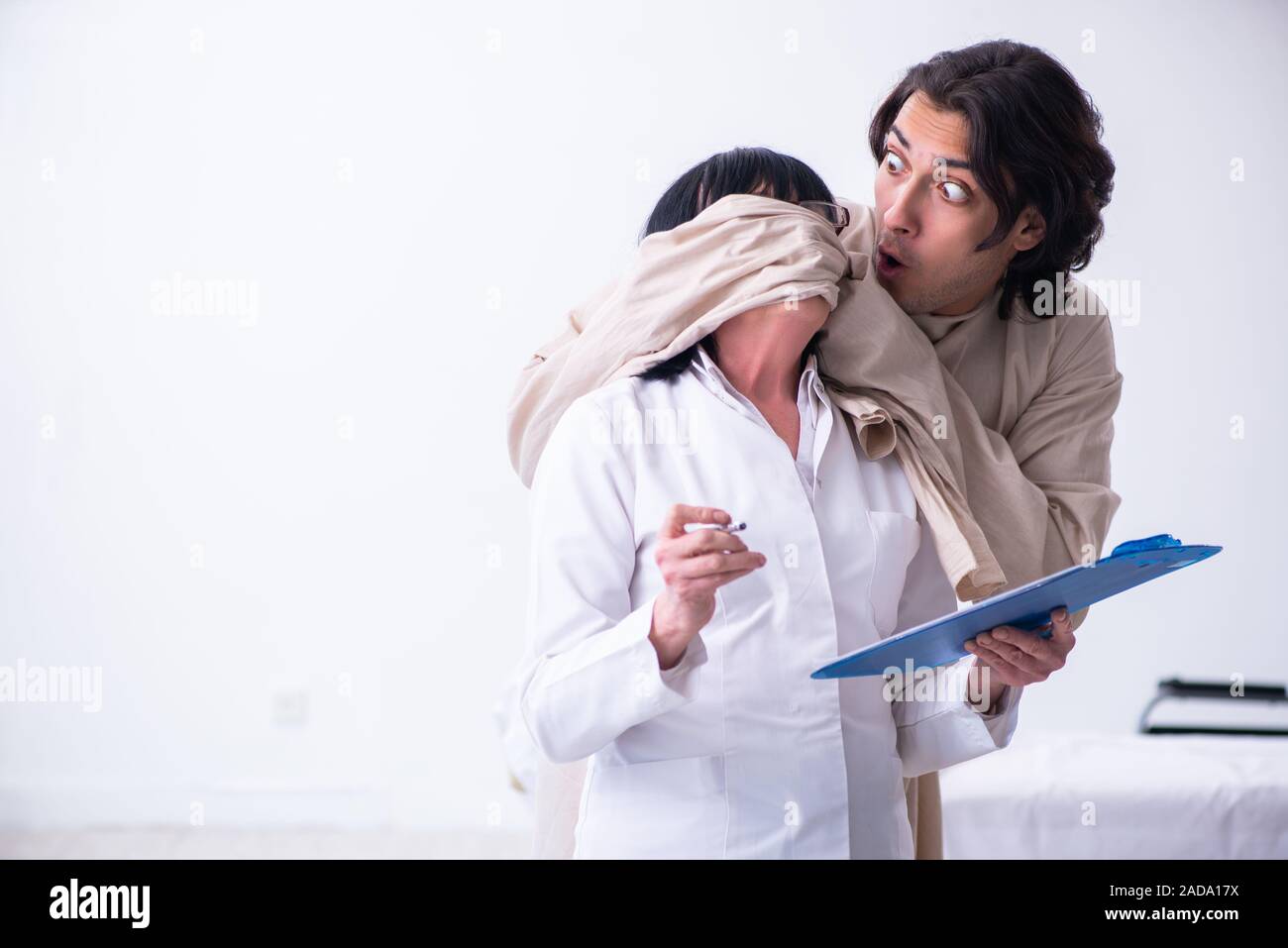 Old female psychiatrist visiting young male patient Stock Photo Alamy