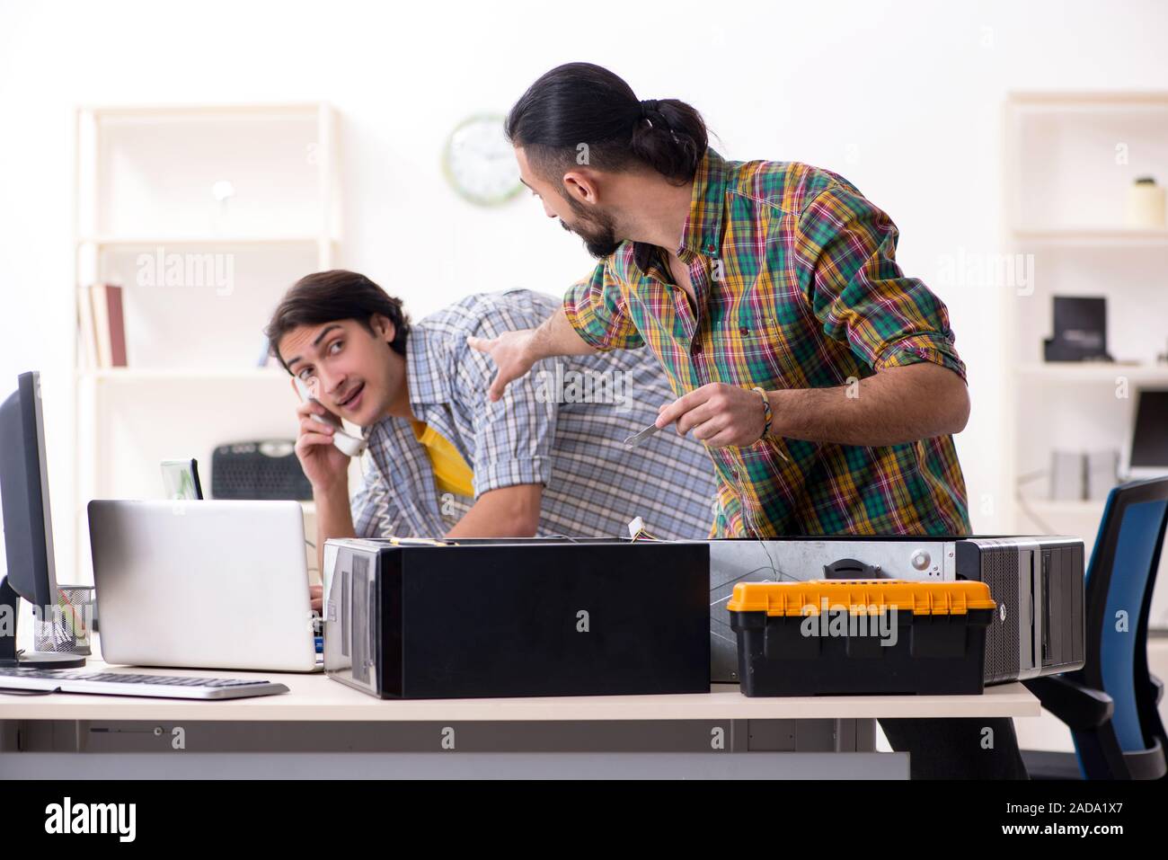 IT engineers working on hardware issue Stock Photo