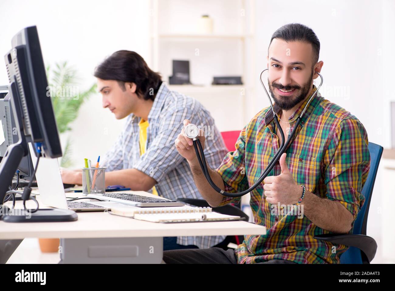IT engineers working on hardware issue Stock Photo