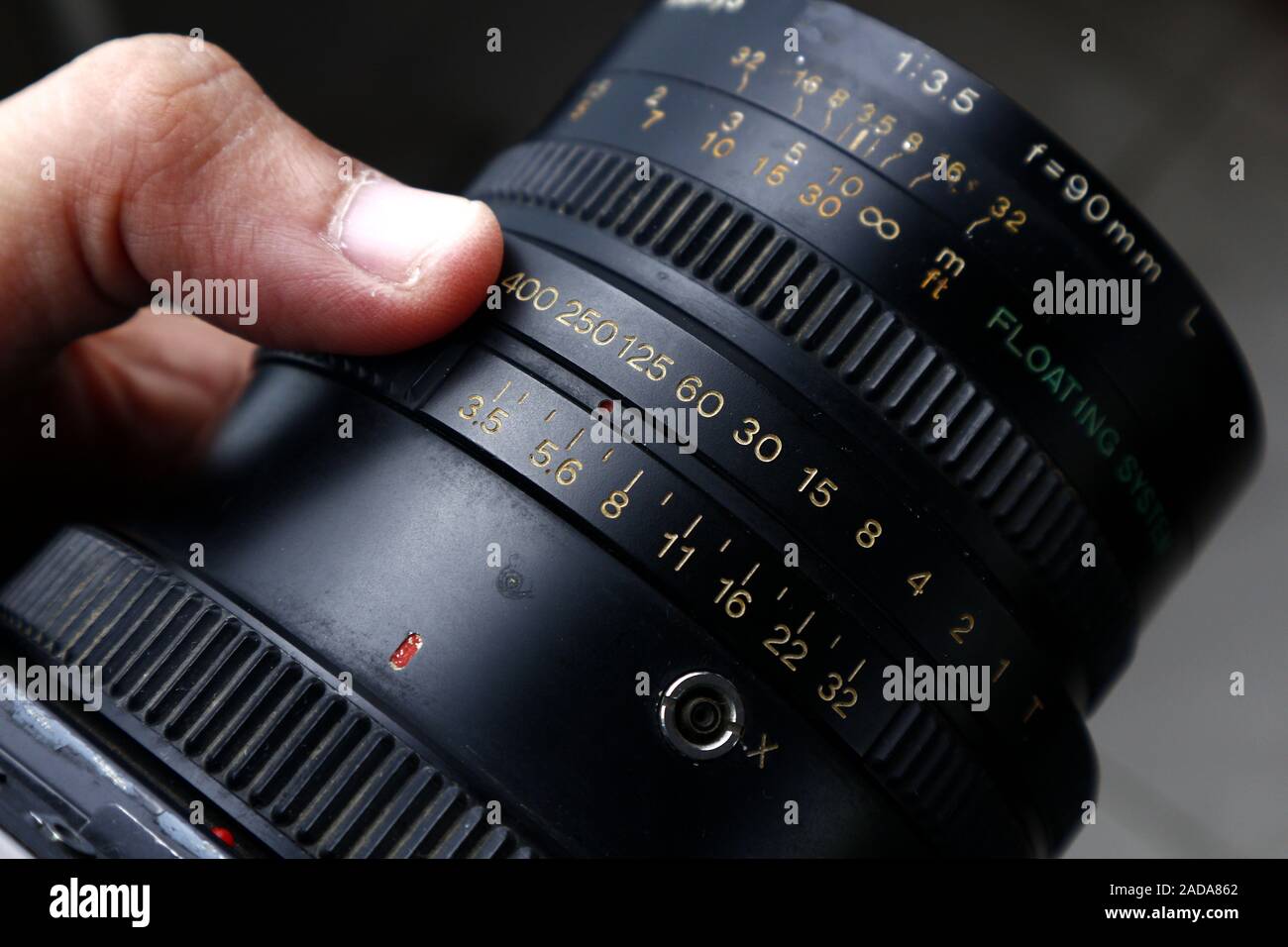 Photo of aperture and shutter speed adjustment ring on the lens of an old  and vintage medium format film camera on a tripod Stock Photo - Alamy