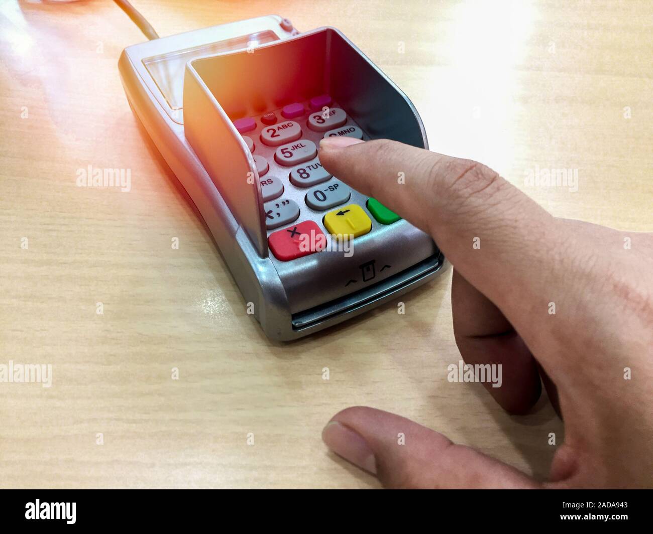 Credit card payment. Finger pointing to the number button on payment ...