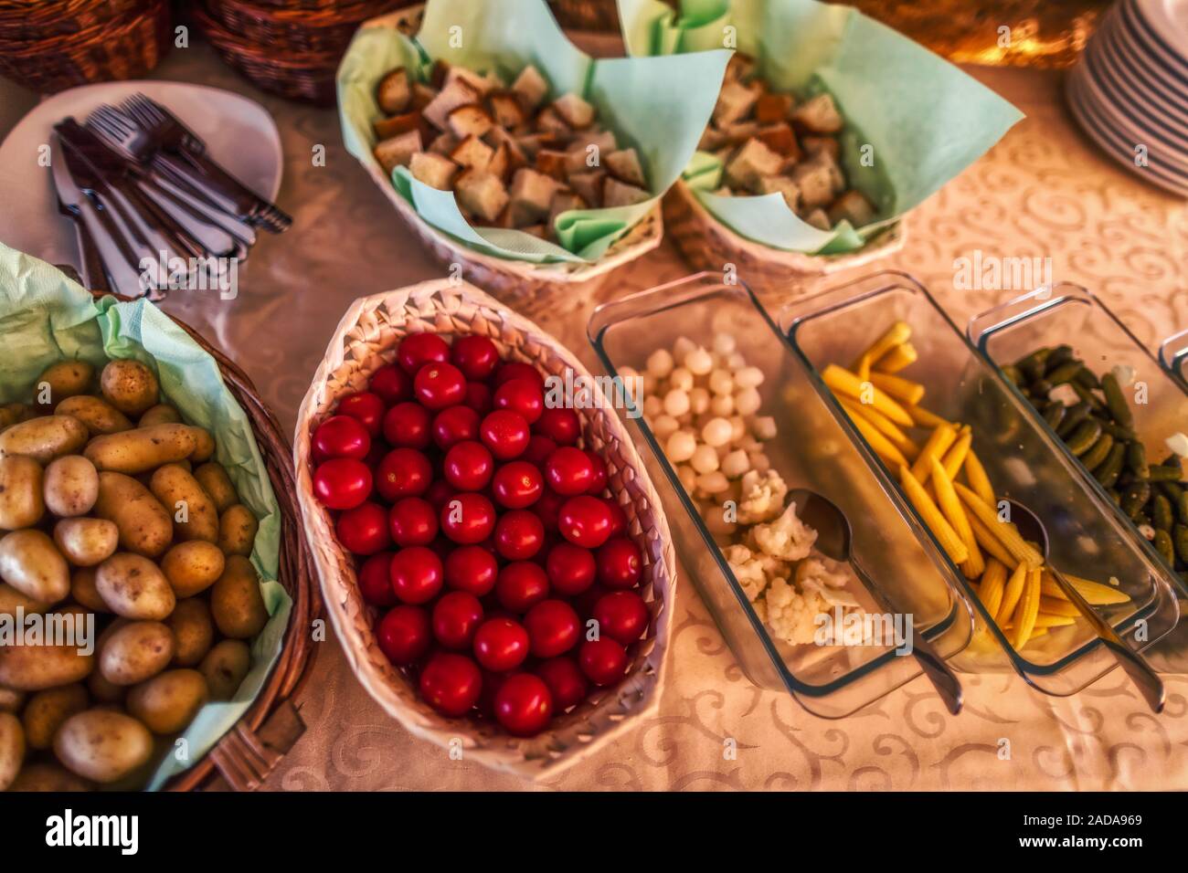 typical side dishes for swiss cheese fondue with bred, potatoes and more, dinner Stock Photo