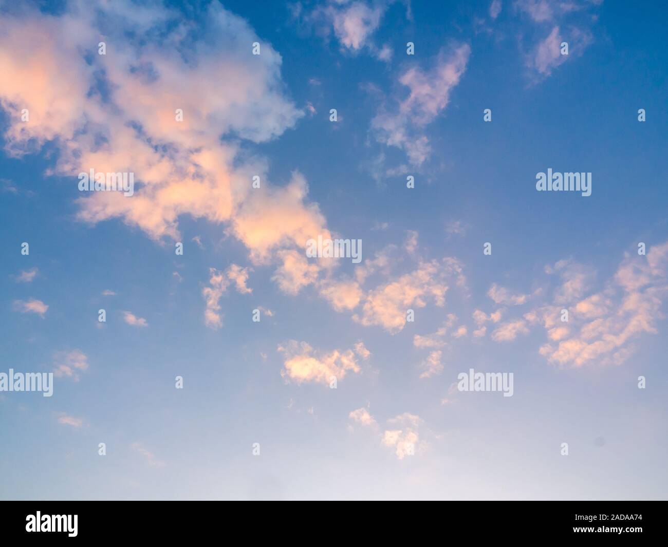 Beautiful golden clouds on sunset sky background. Blue sky background ...