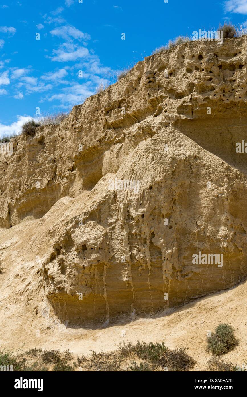 Stratified wall of the gorge in the Spanish badlands Bardenas Reales Stock Photo