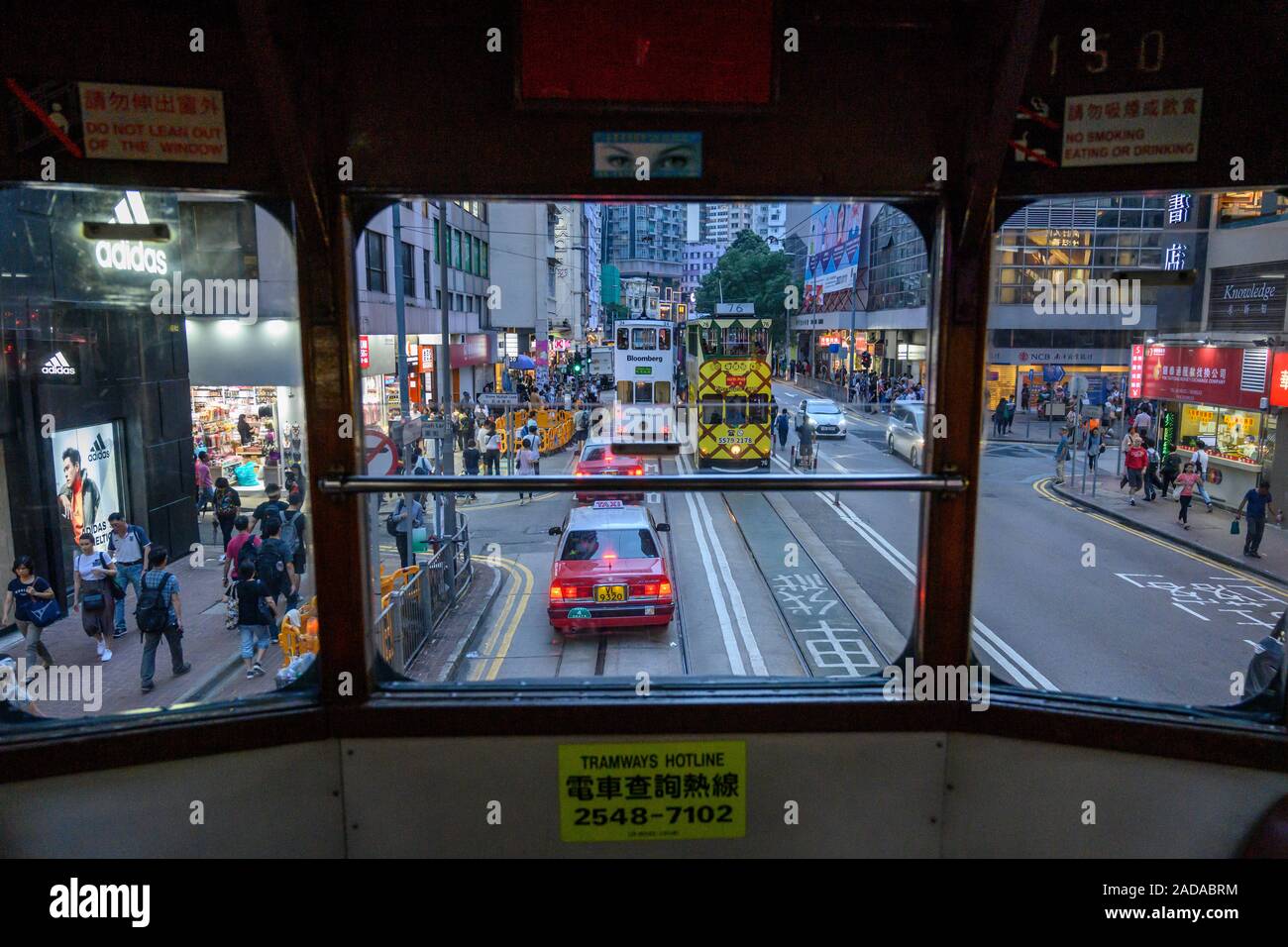 View of Wan Chai street from the inside of a tram Hong Kong Stock Photo