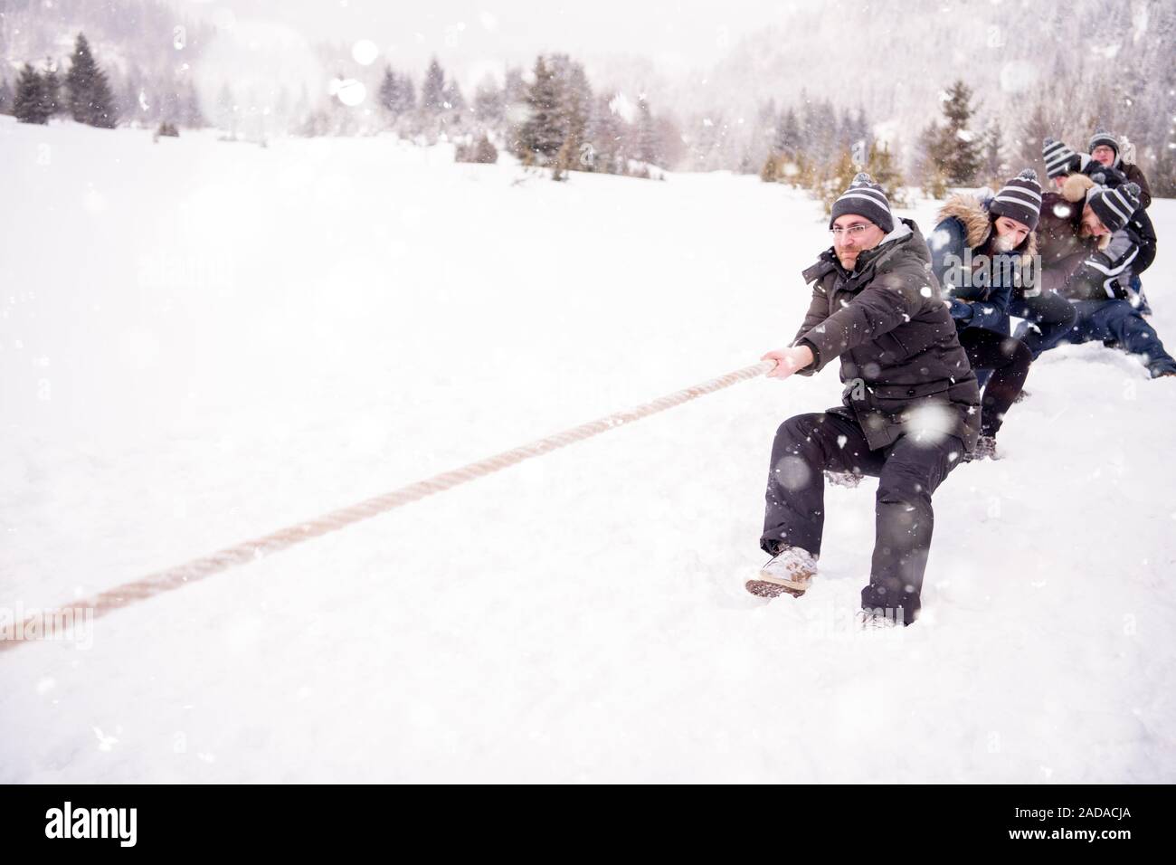 group of young people pulling a rope in tug of war competition Stock ...