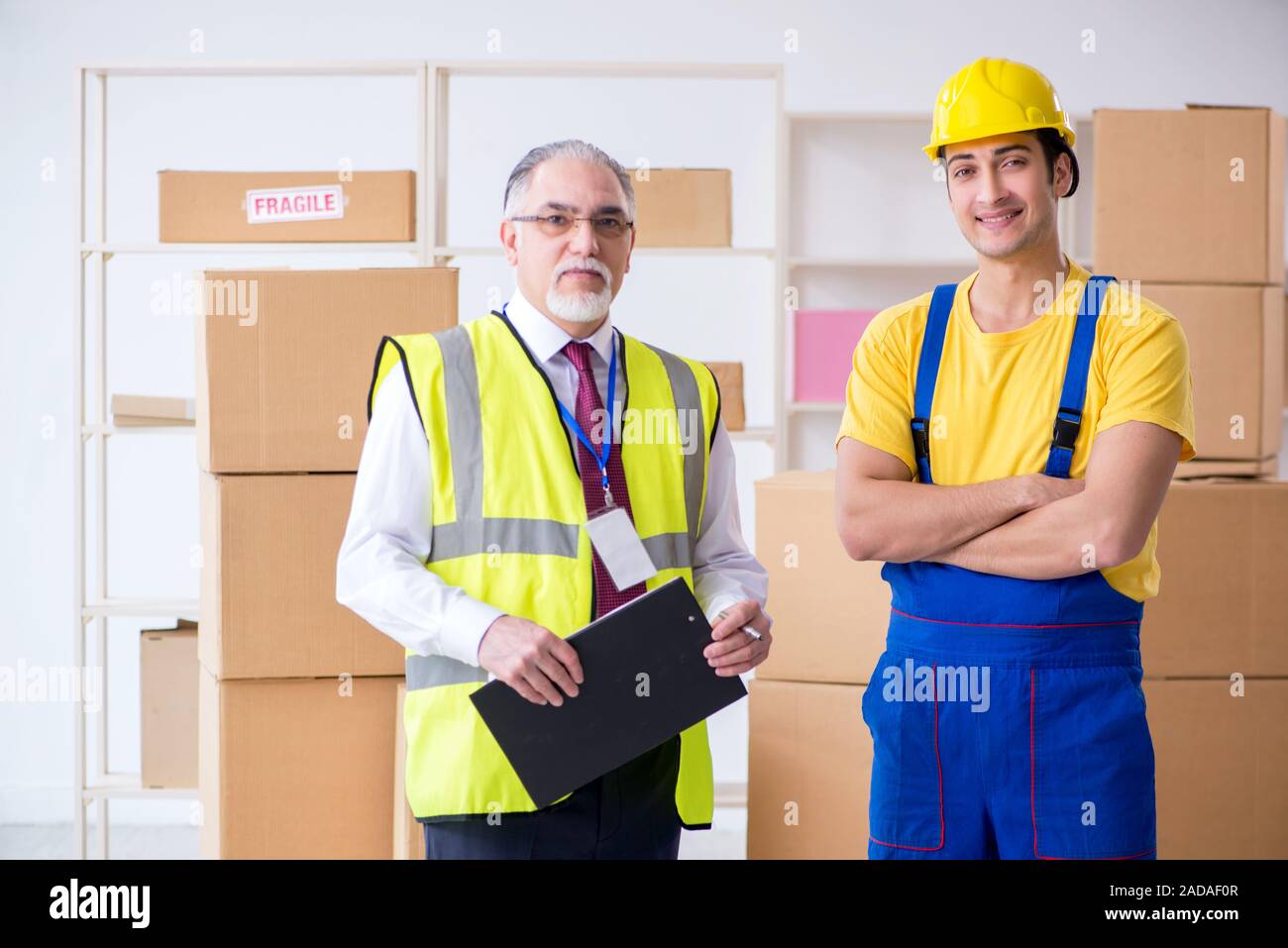 Professional movers doing home relocation Stock Photo
