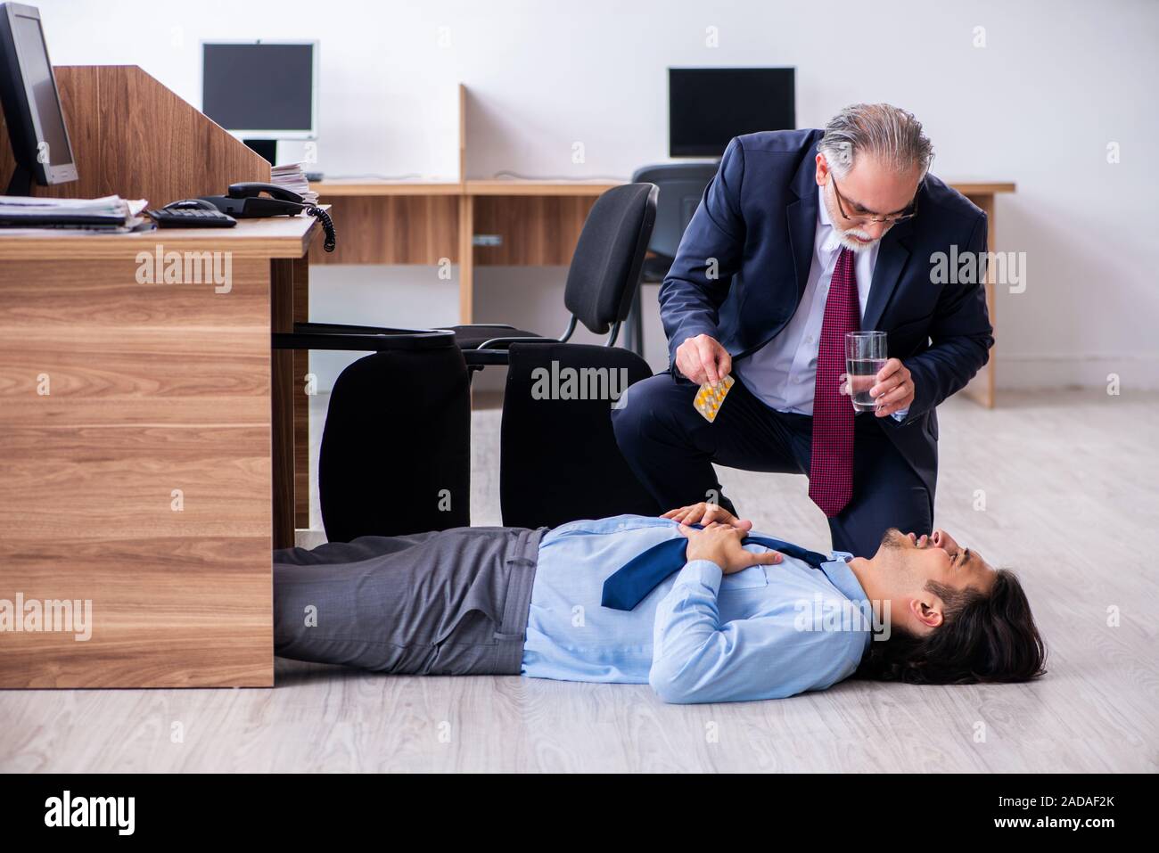 Male employee suffering from heart attack in the office Stock Photo Alamy