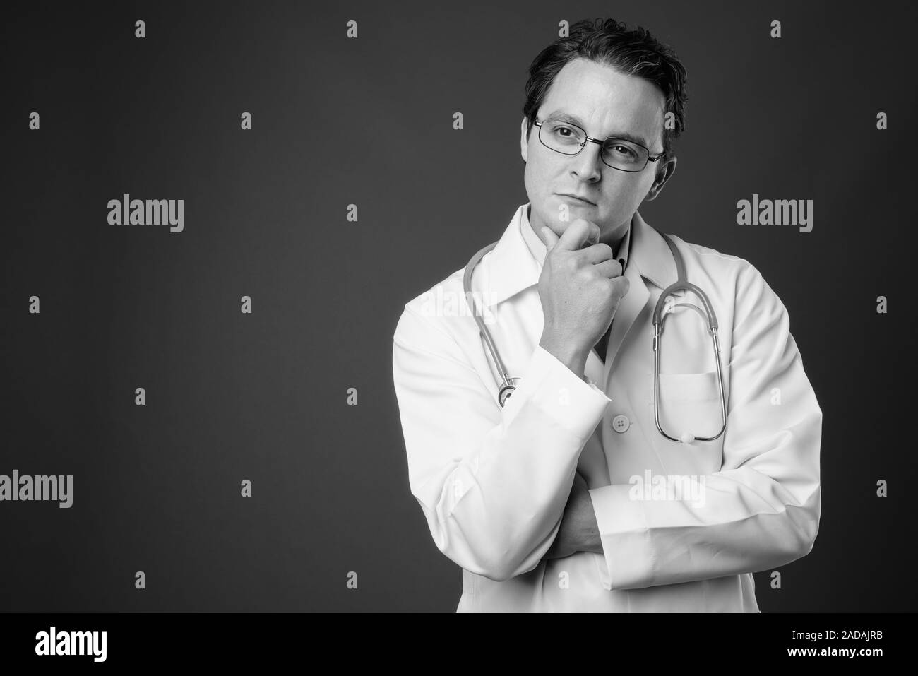 Black man lab coat thinking Black and White Stock Photos & Images - Alamy