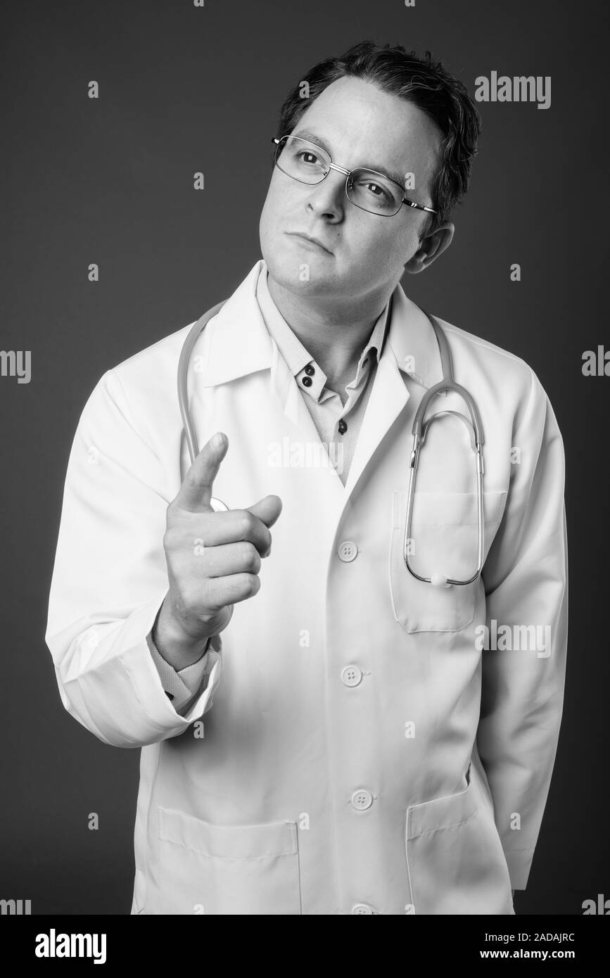 Black man lab coat thinking Black and White Stock Photos & Images - Alamy