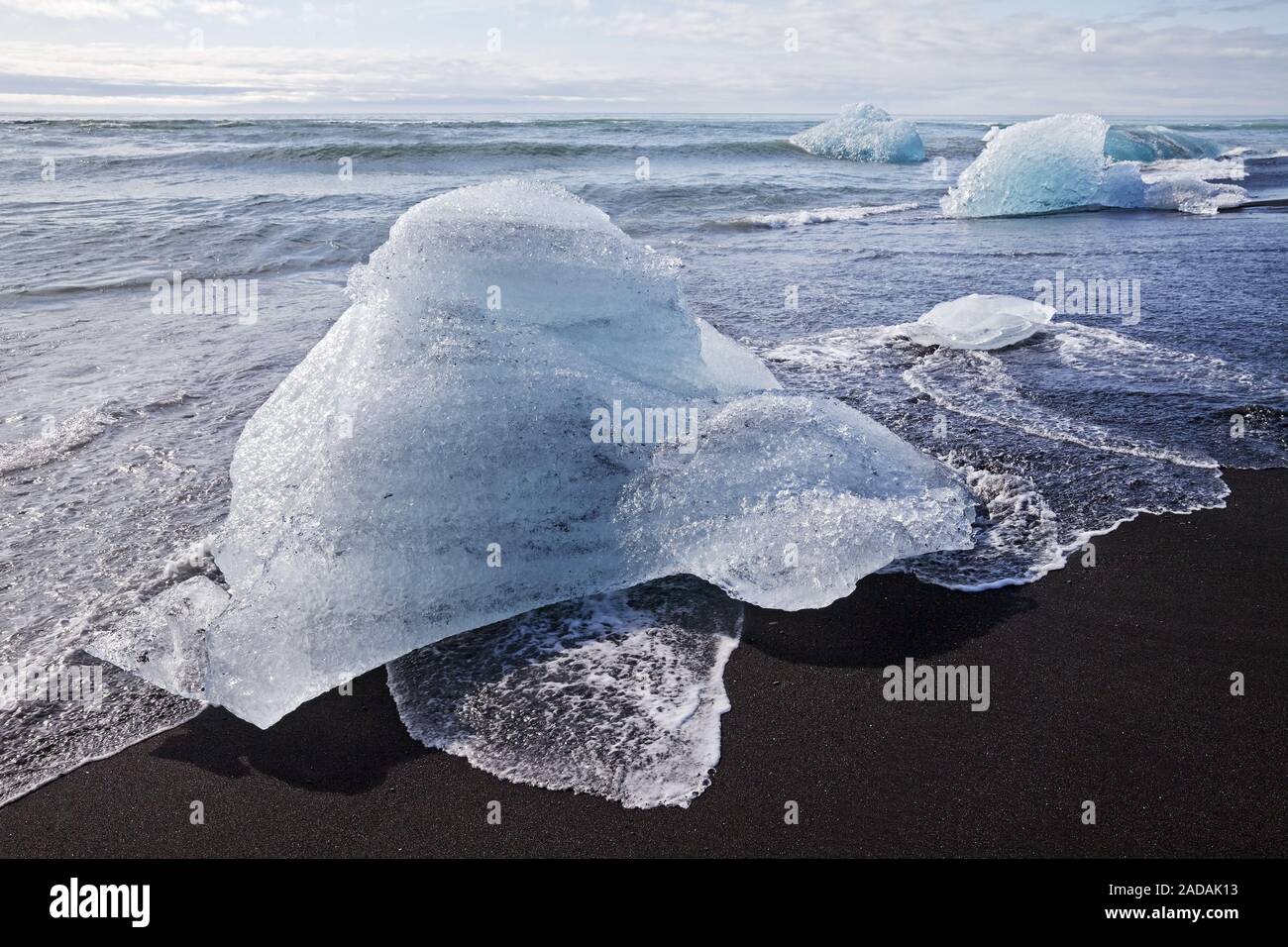glacial ice in the sea surf, Breidamerkursandur, near the Joeklusárlón, Iceland, Europe Stock Photo