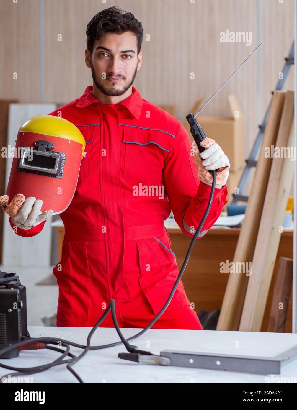 Young repairman with a welding gun electrode and a hi-res stock photography  and images - Alamy