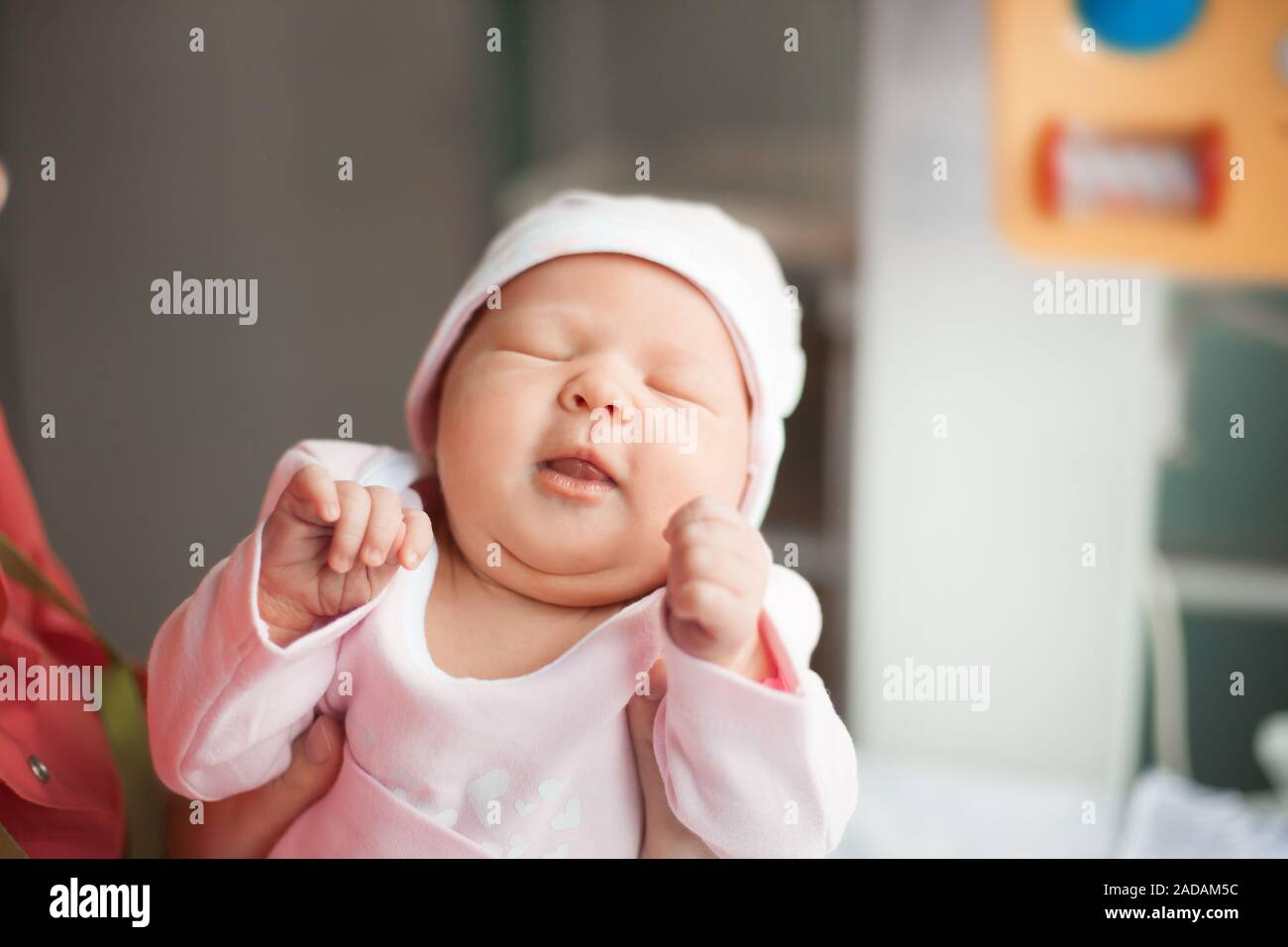 close up. mom dressing her newborn baby for a walk. photo with copy space Stock Photo