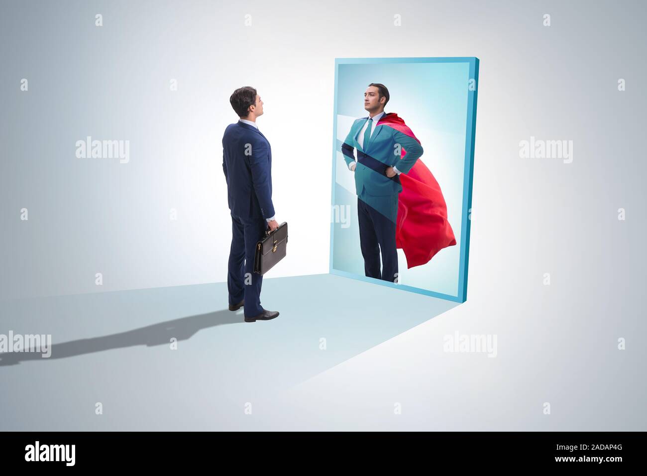 Businessman seeing himself in mirror as superhero Stock Photo - Alamy