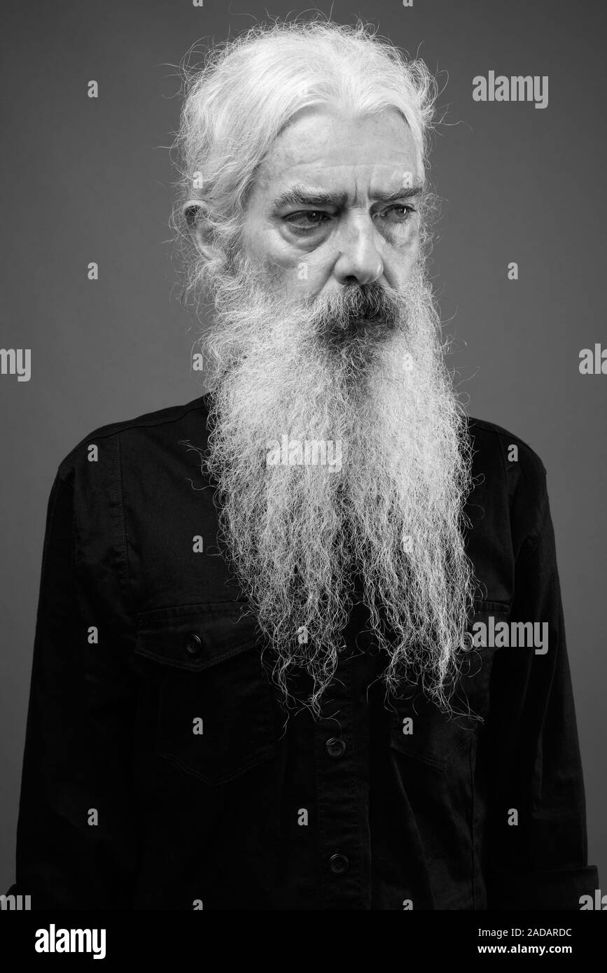Senior man with long hair and beard in black and white Stock Photo - Alamy