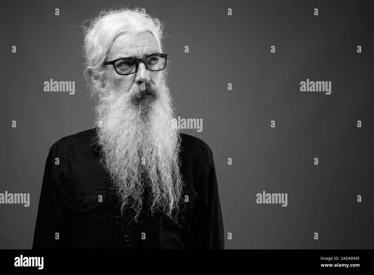 Senior man with long hair and beard in black and white Stock Photo - Alamy