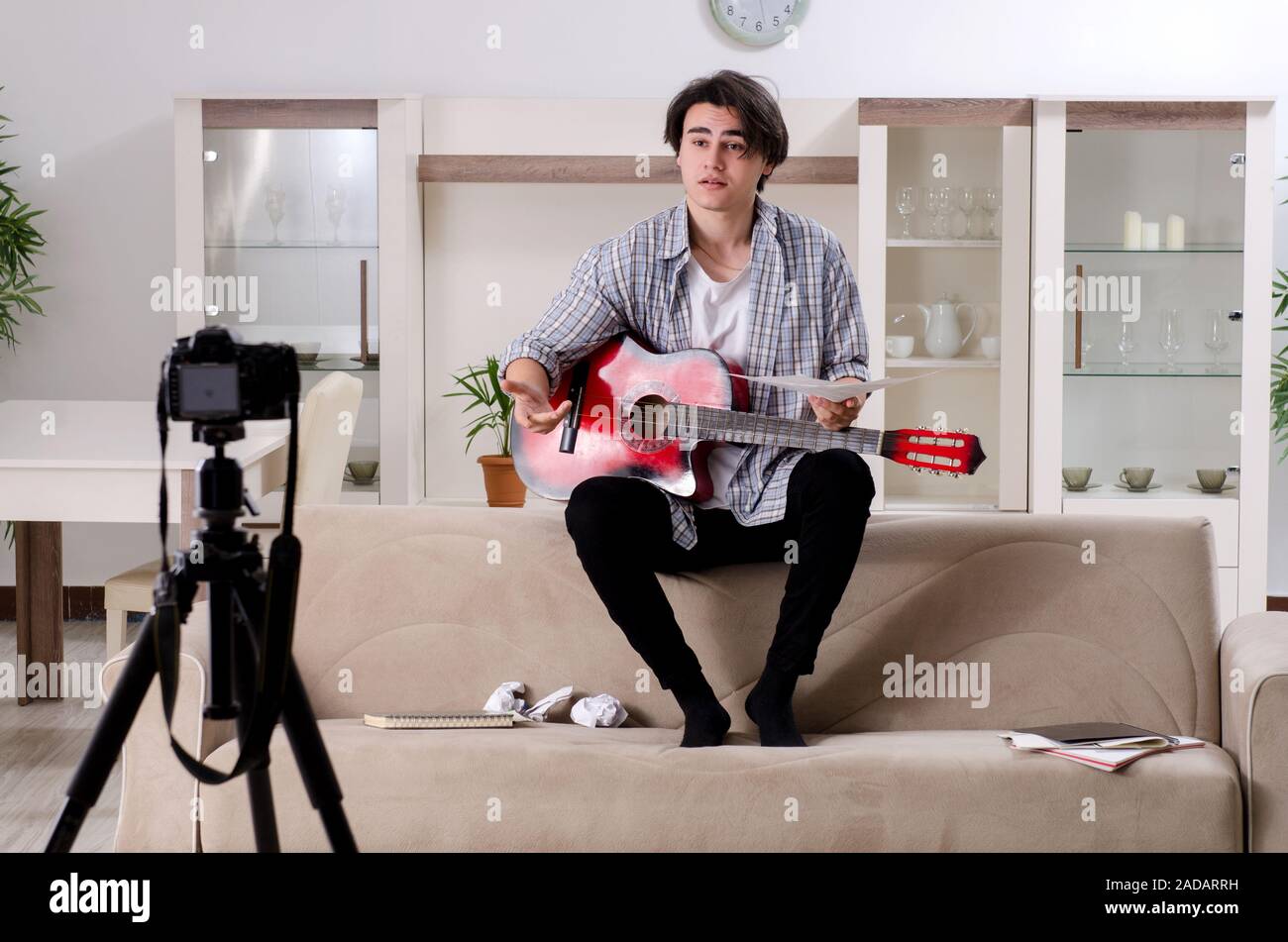 Young guitar player recording video for his blog Stock Photo