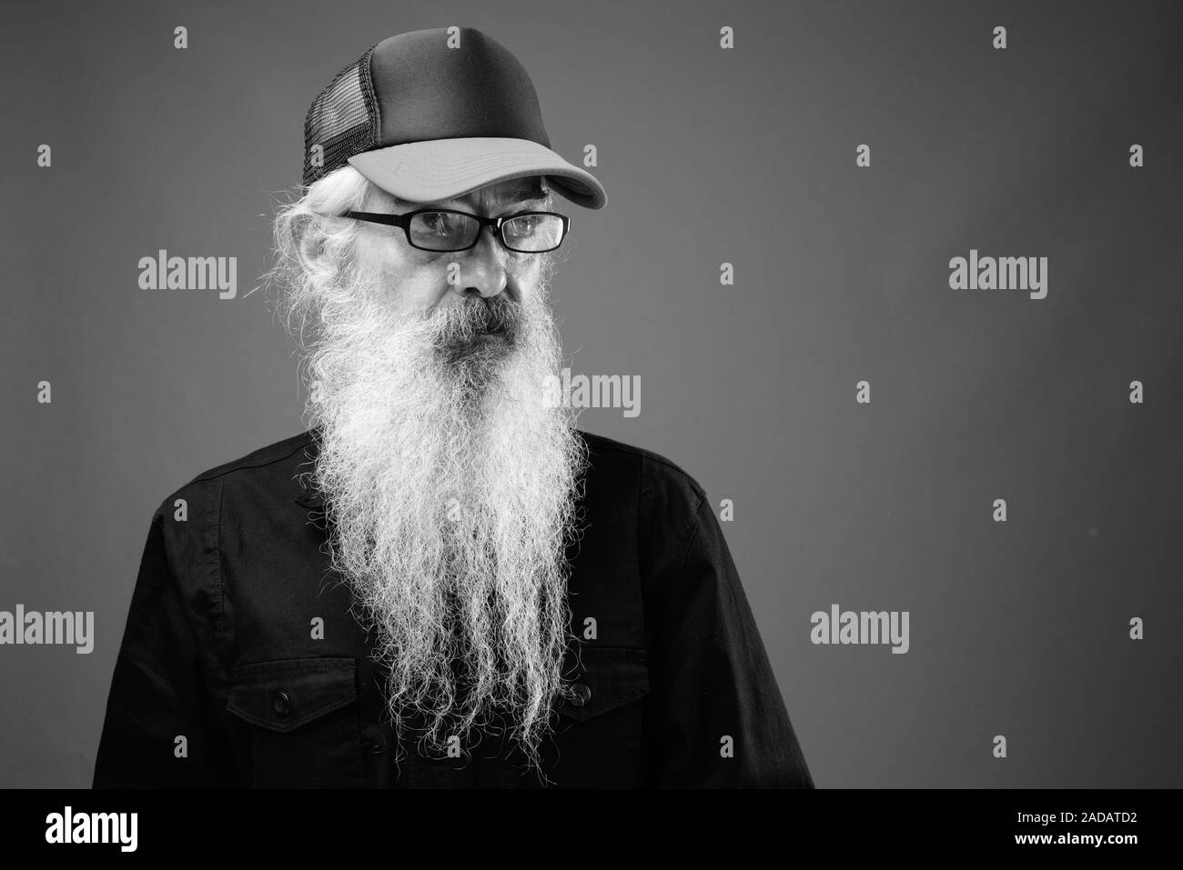 Senior man with long hair and beard in black and white Stock Photo - Alamy