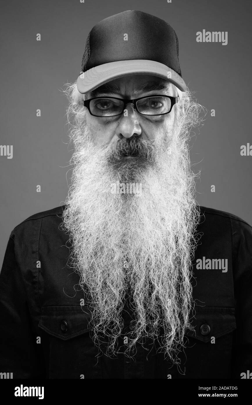 Senior man with long hair and beard in black and white Stock Photo - Alamy