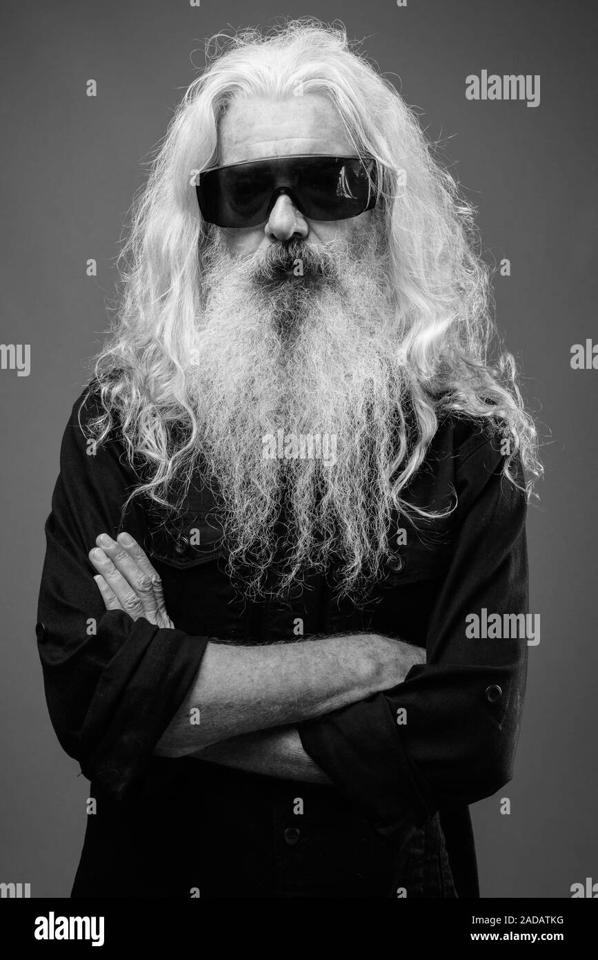 Senior man with long hair and beard in black and white Stock Photo - Alamy
