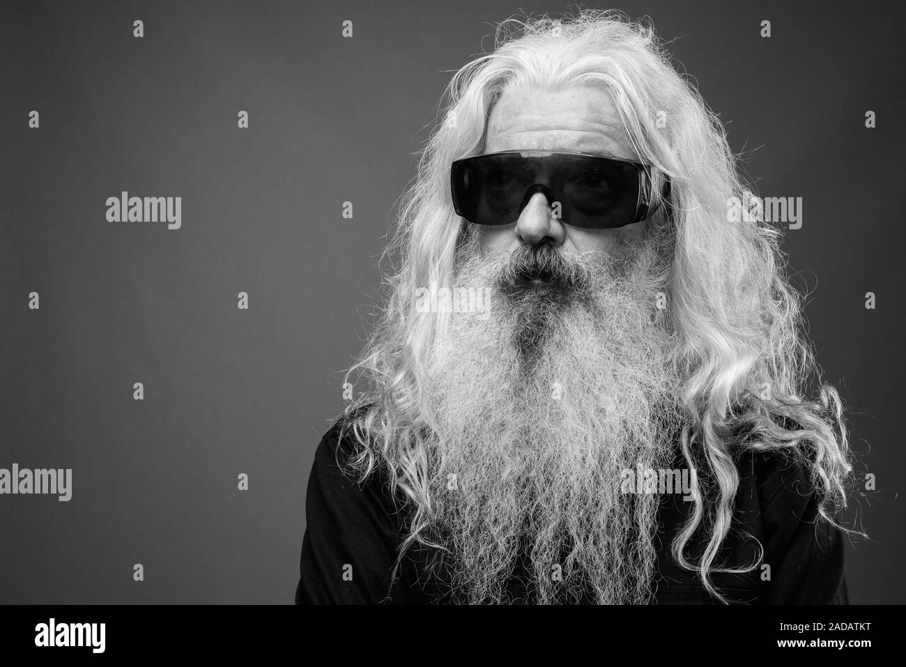 Senior man with long hair and beard in black and white Stock Photo - Alamy