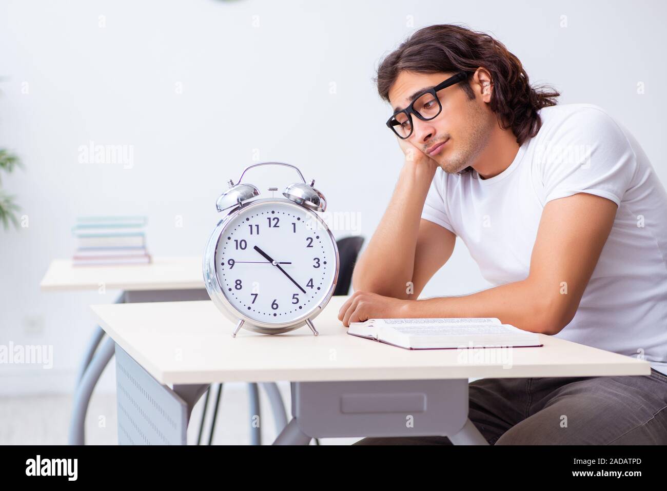 Young male student sitting in the classroom Stock Photo - Alamy