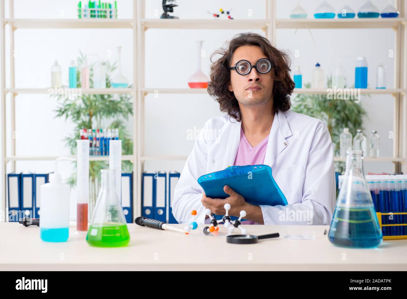 Funny male chemist working in the lab Stock Photo