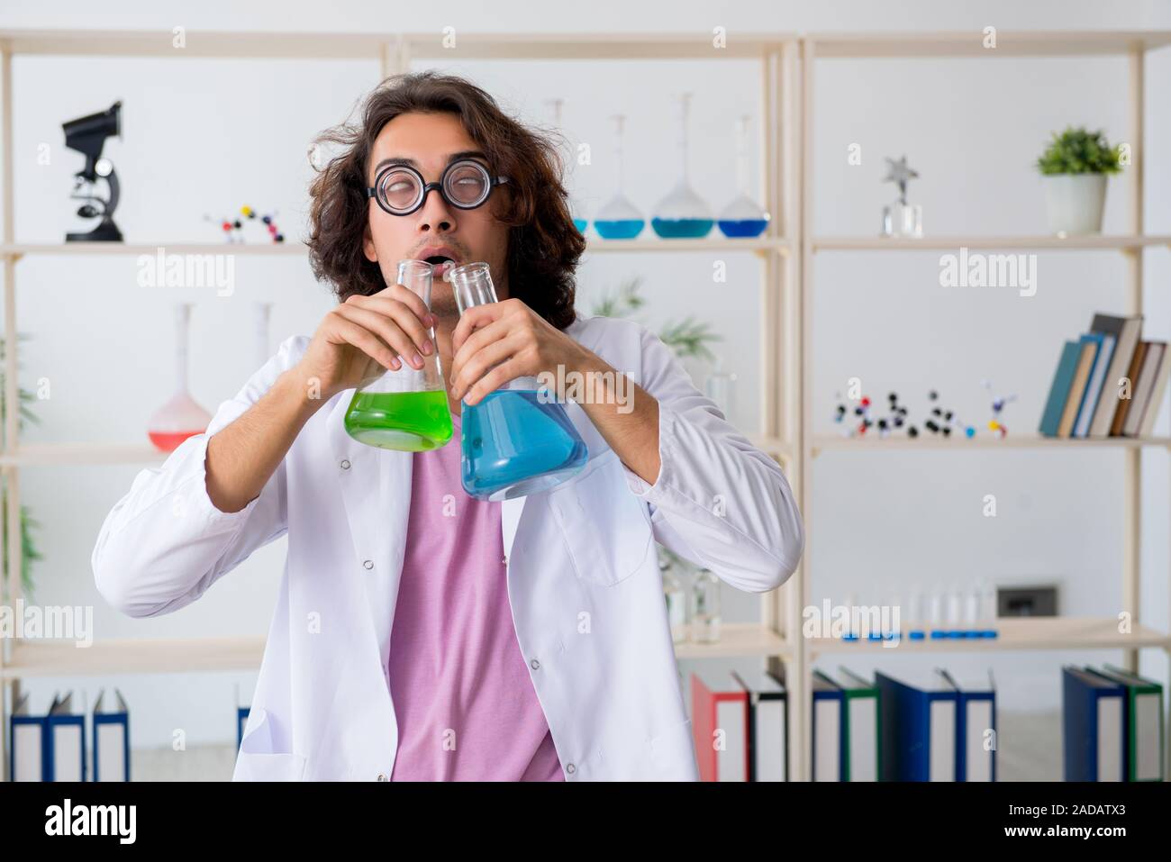 Funny male chemist working in the lab Stock Photo