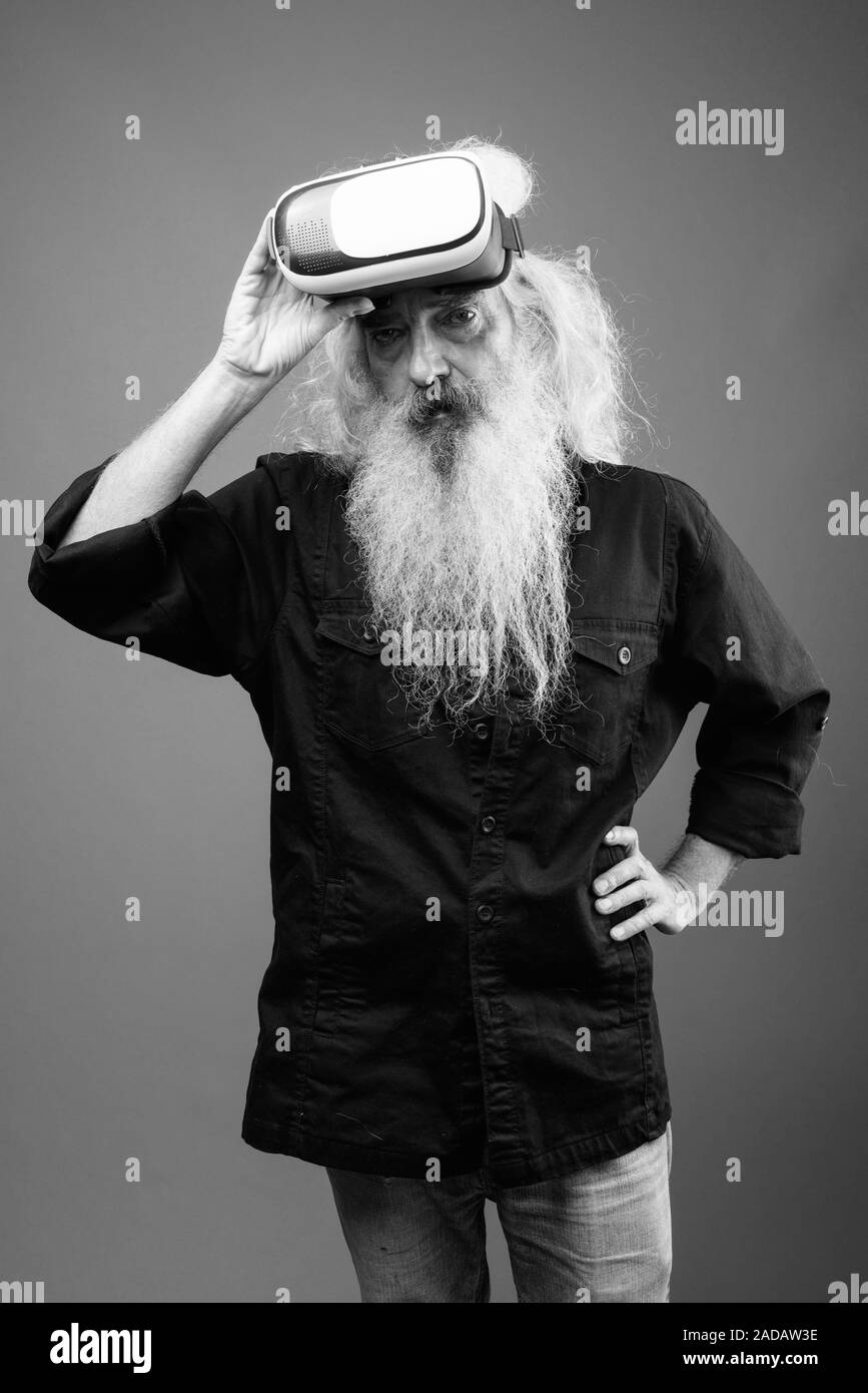 Senior man with long hair and beard in black and white Stock Photo