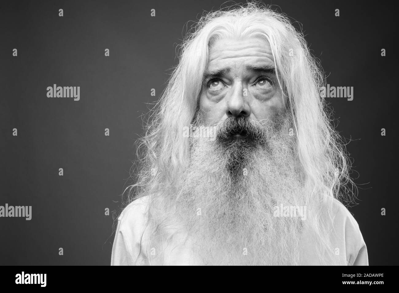 Senior man with long hair and beard in black and white Stock Photo - Alamy