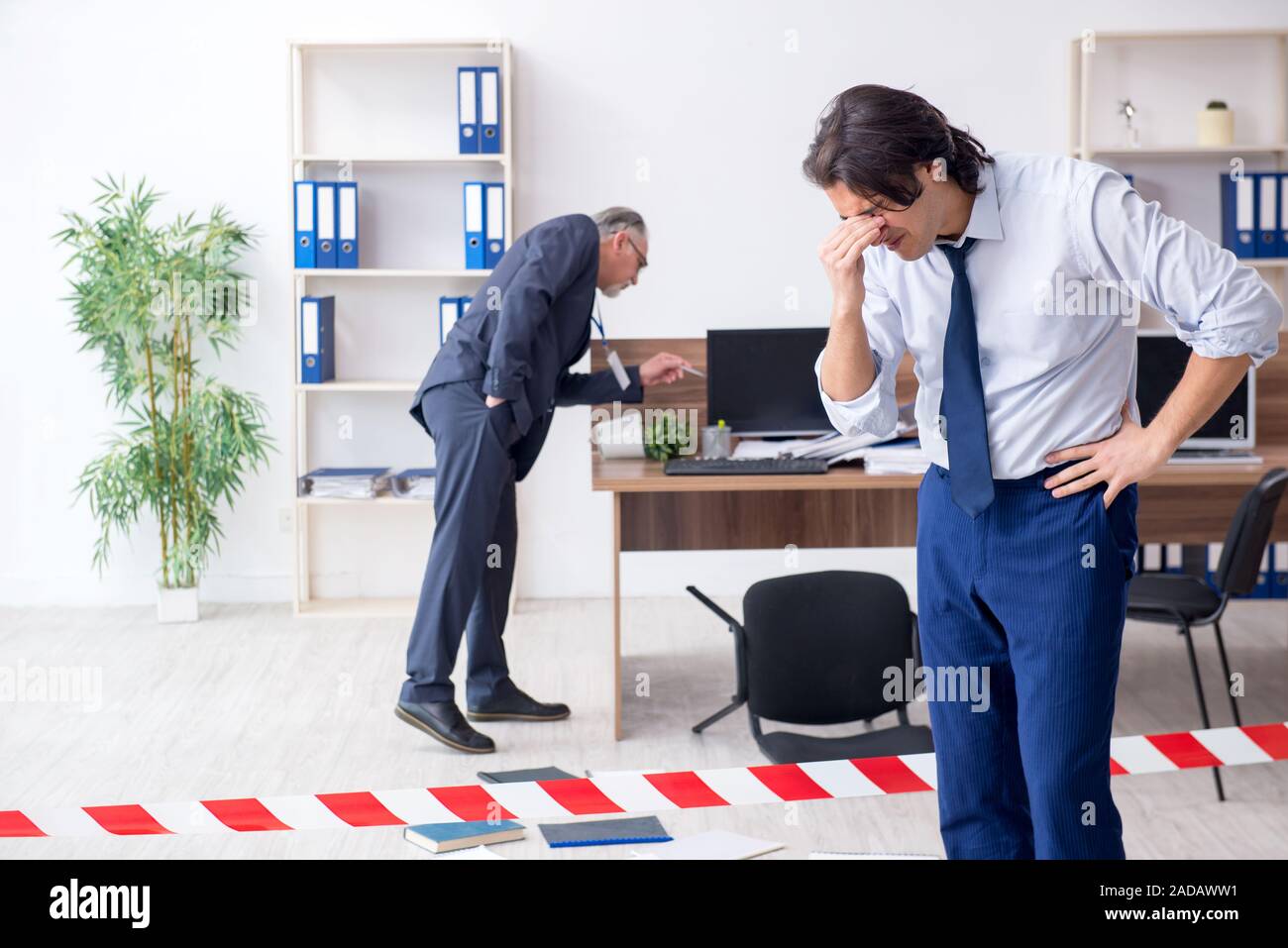 Forensic investigator investigating theft in the office Stock Photo