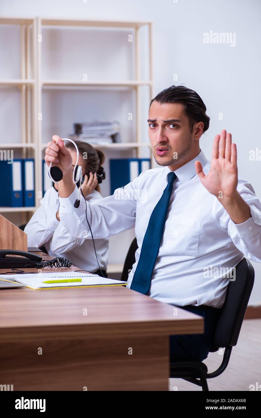Call center operators working in the office Stock Photo - Alamy