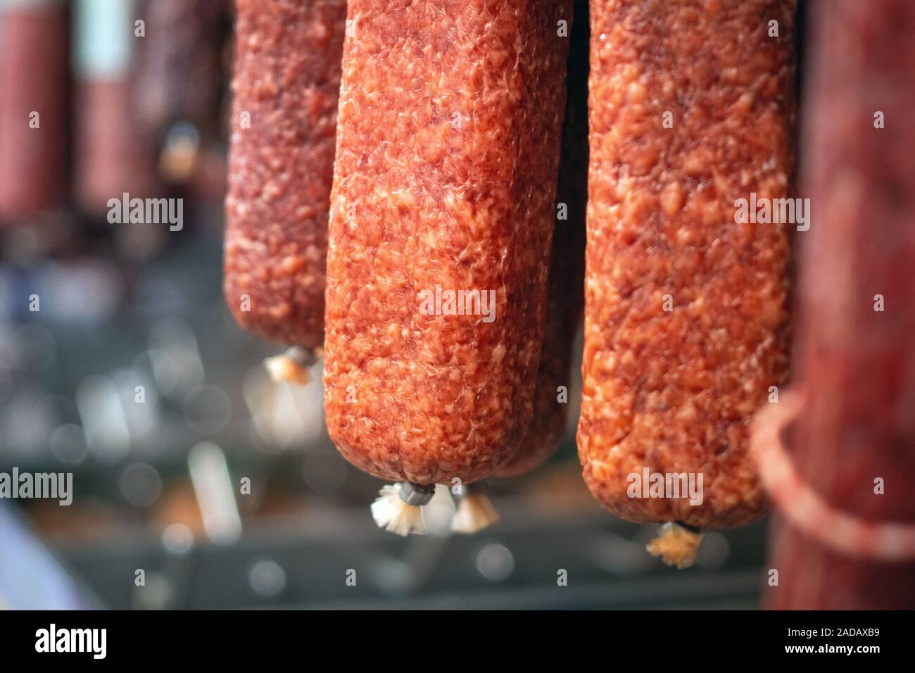 smoked sausage close up in hypermarkets selling meat products Stock Photo