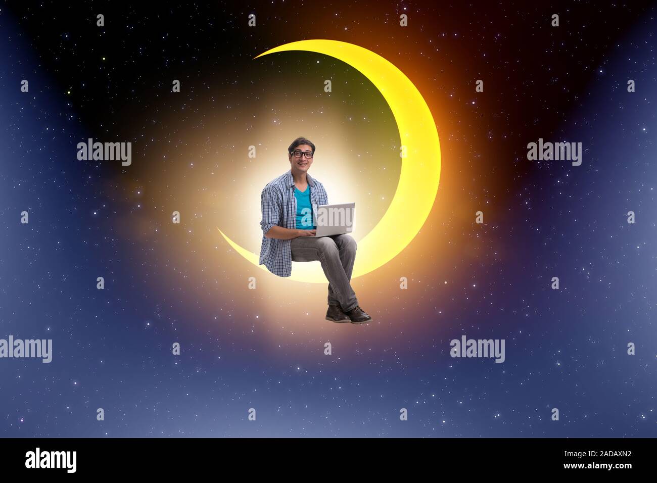 Student working on laptop on the moon crescent Stock Photo