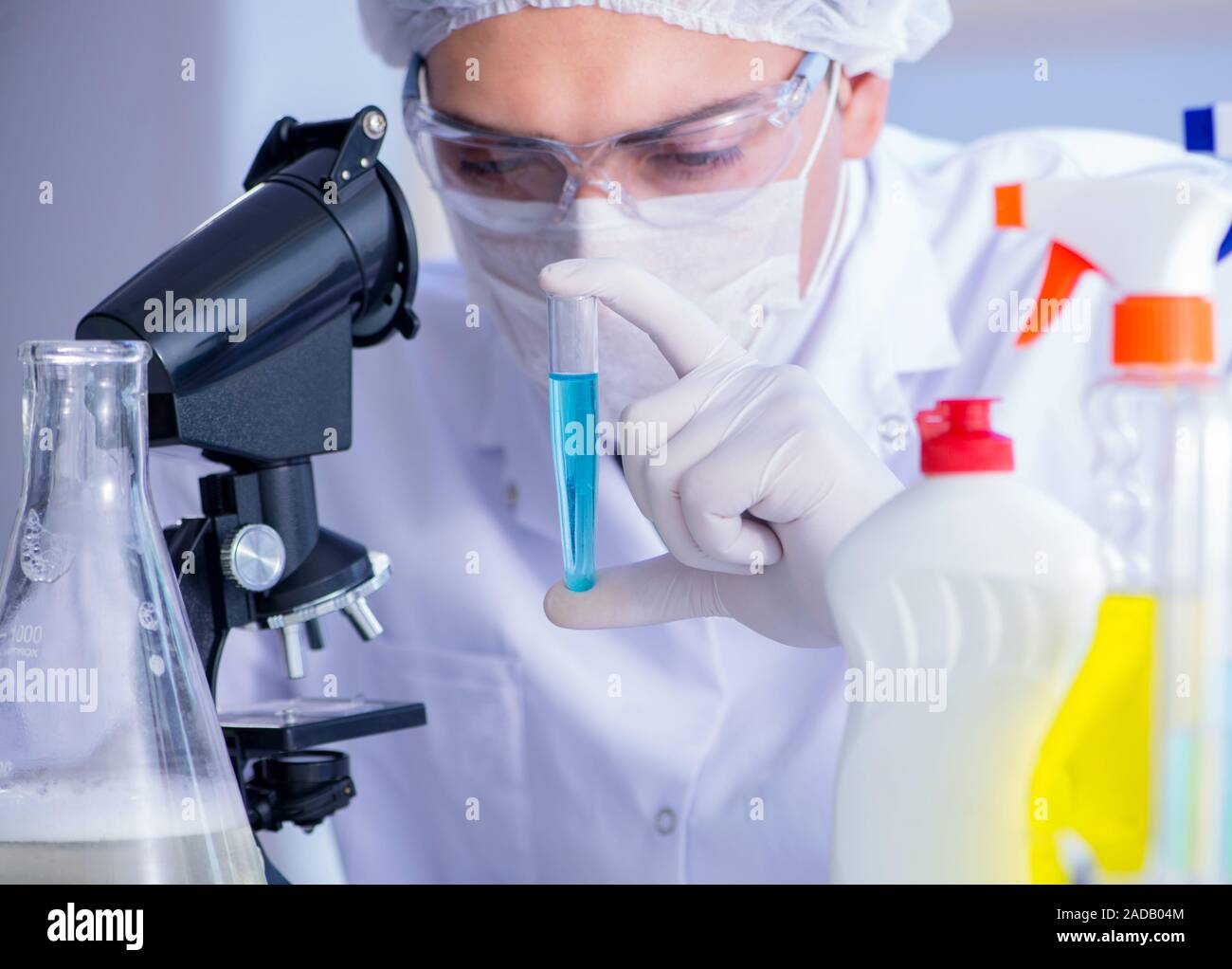 Man in the lab testing new cleaning solution detergent Stock Photo Alamy