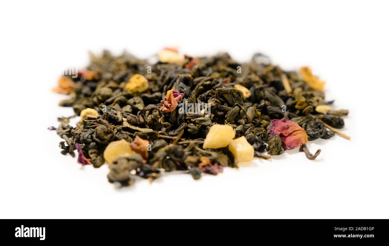 Green tea with aromatic additives. Top view on white background Stock ...