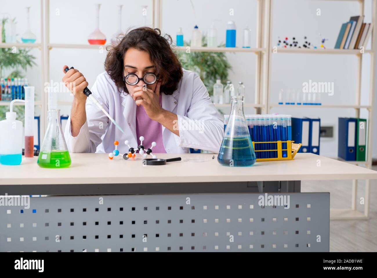 Funny male chemist working in the lab Stock Photo