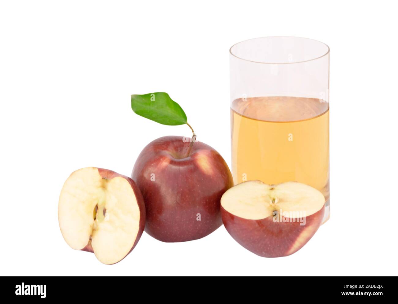 Glass of natural apple juce and sections of apple Stock Photo - Alamy