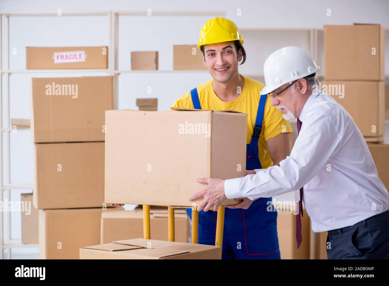 Professional movers doing home relocation Stock Photo
