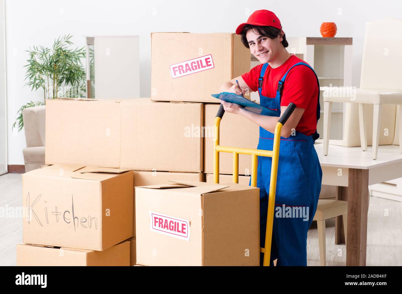 Young contractor boxes working hi-res stock photography and images - Alamy