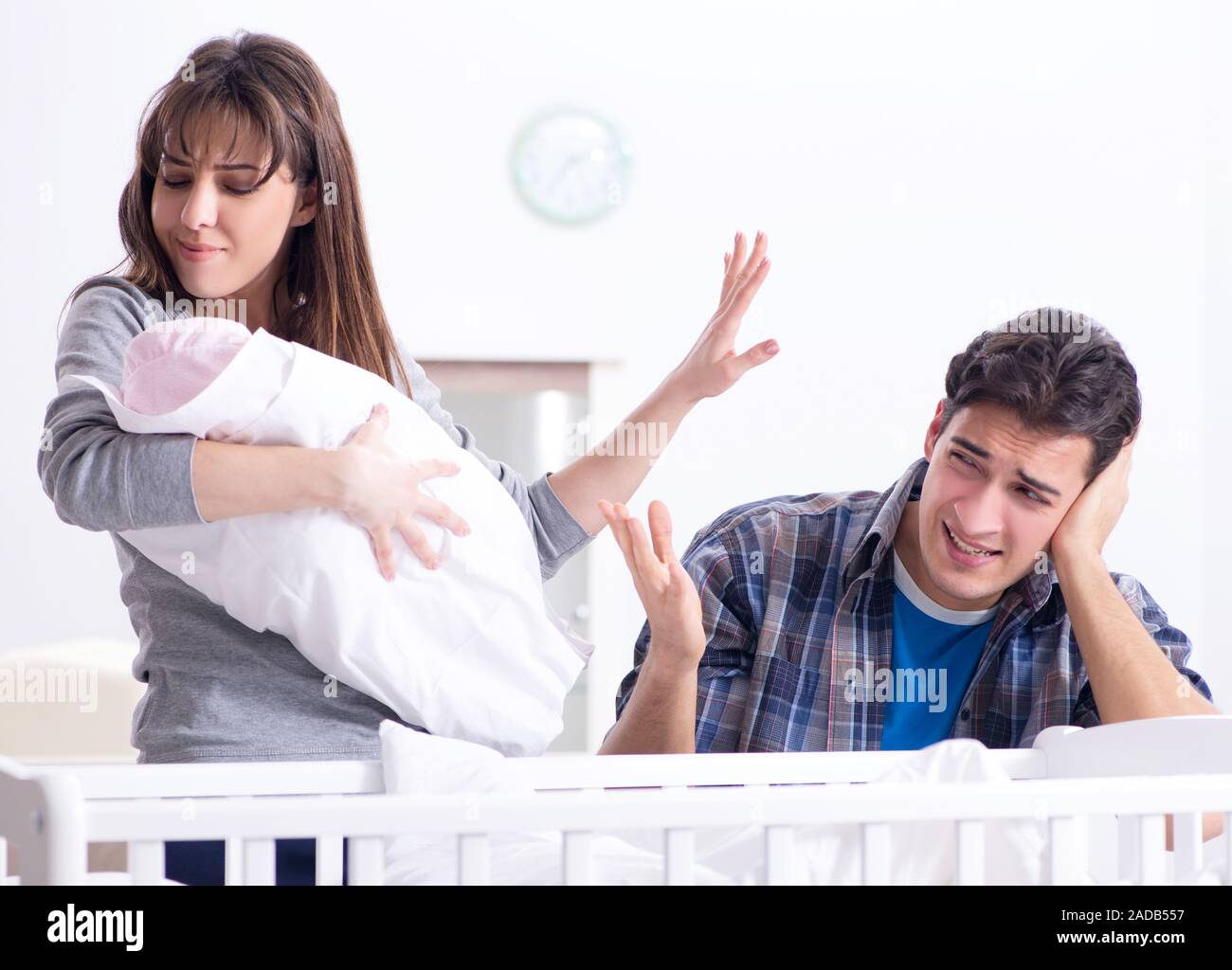 Young dad cannot stand baby crying Stock Photo - Alamy