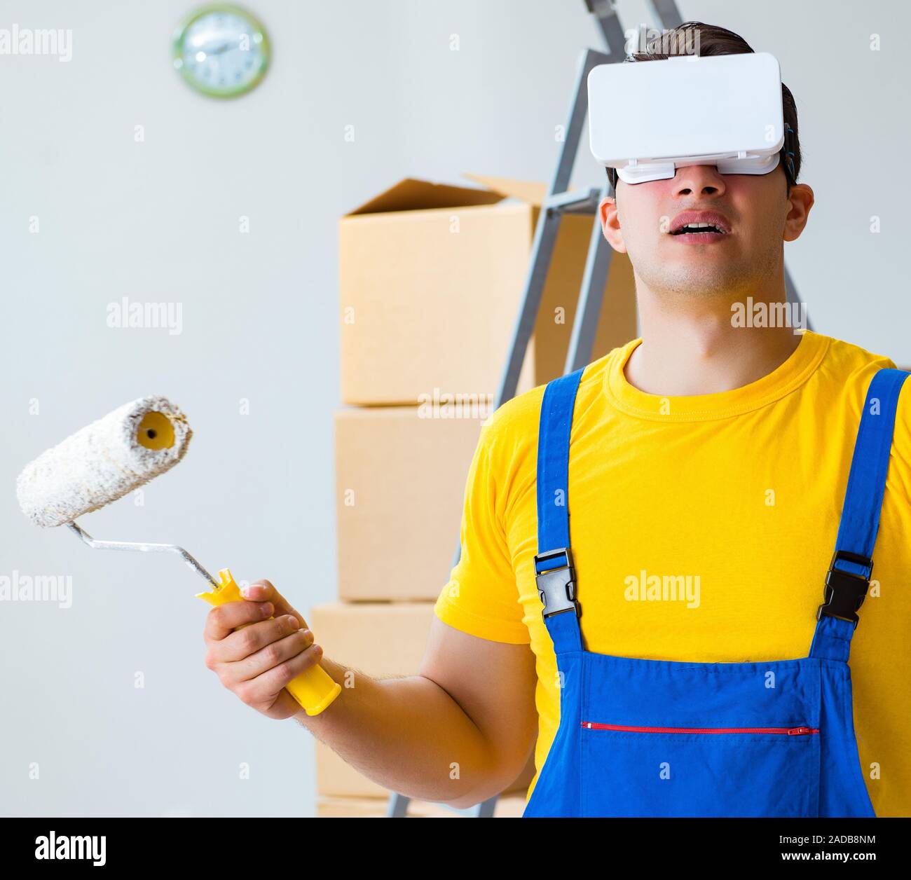 Painter contractor working with virtual reality goggles Stock Photo